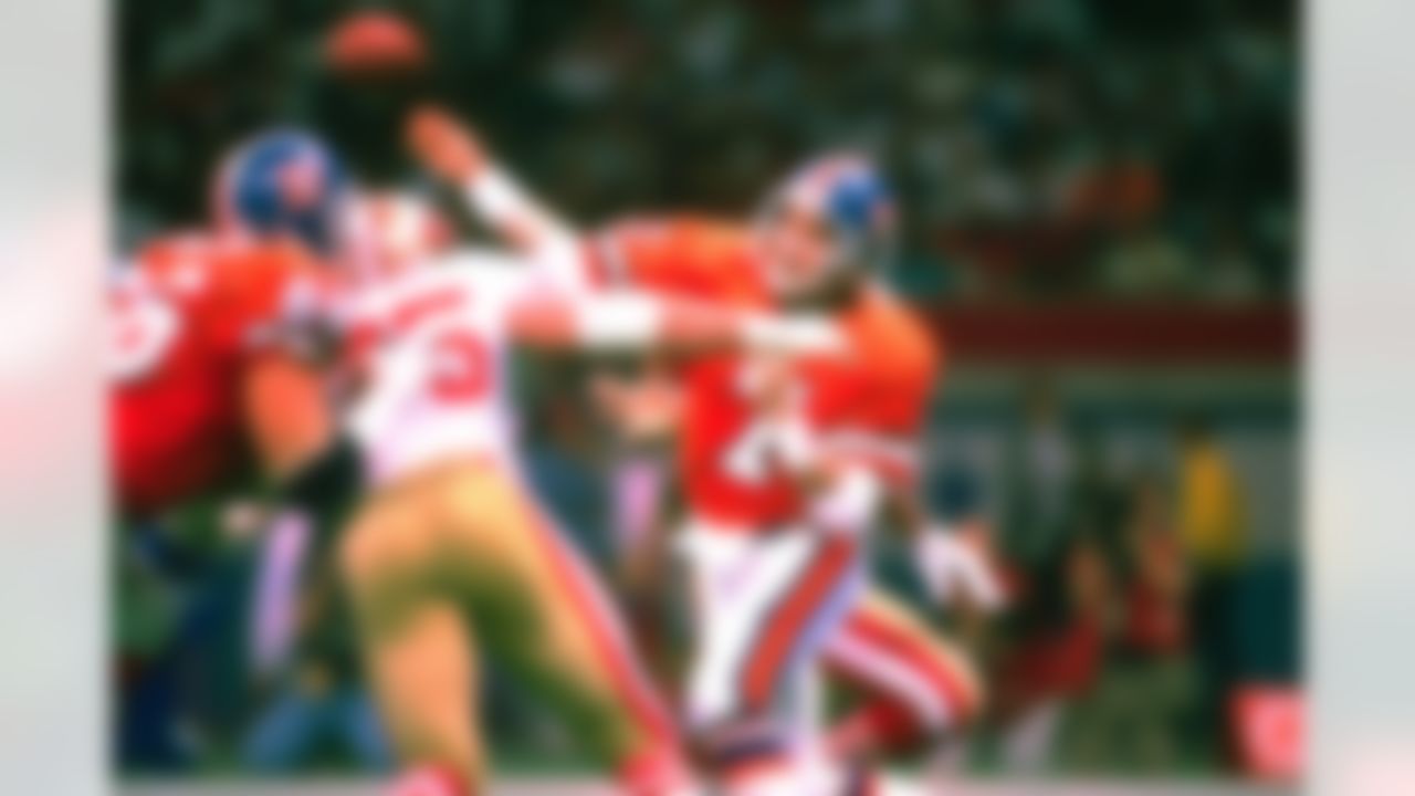 Denver Broncos quarterback John Elway (7) releases a pass at Super Bowl XXIV in New Orleans on January 28, 1990. (AP Photo/Al Messerschmidt)