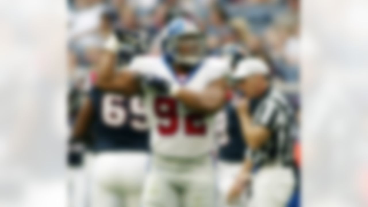 New York Giants' Michael Strahan (92) flexes his muscle after sacking Houston Texans quarterback David Carr during the first quarter Sunday, Nov. 24, 2002, in Houston. (AP Photo/Richard Carson)