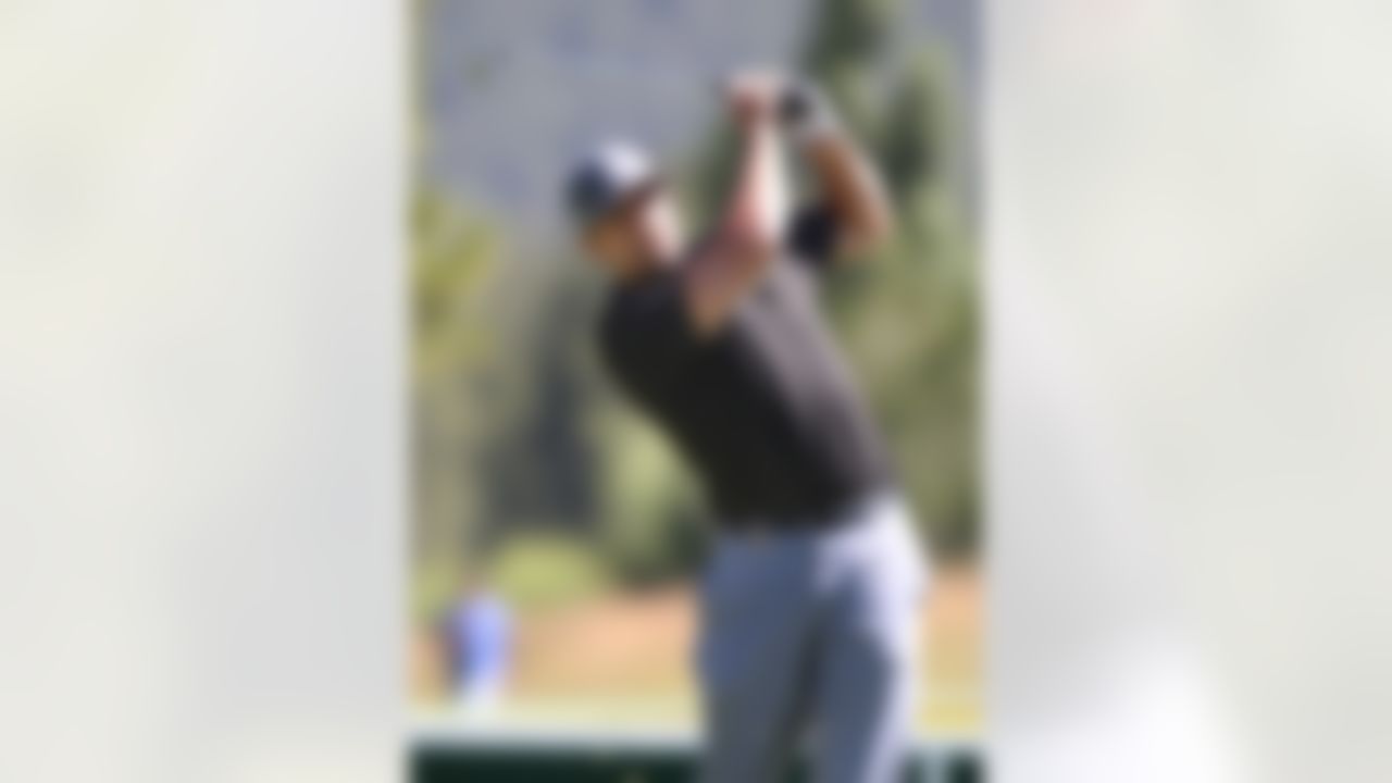Green Bay Packers quarterback Aaron Rodgers plays in a practice round at the 22nd American Century Celebrity Golf Championship at Edgewood Tahoe Golf Course in Stateline, Nev., on Thursday, July 14, 2011. (AP Photo/Cathleen Allison)