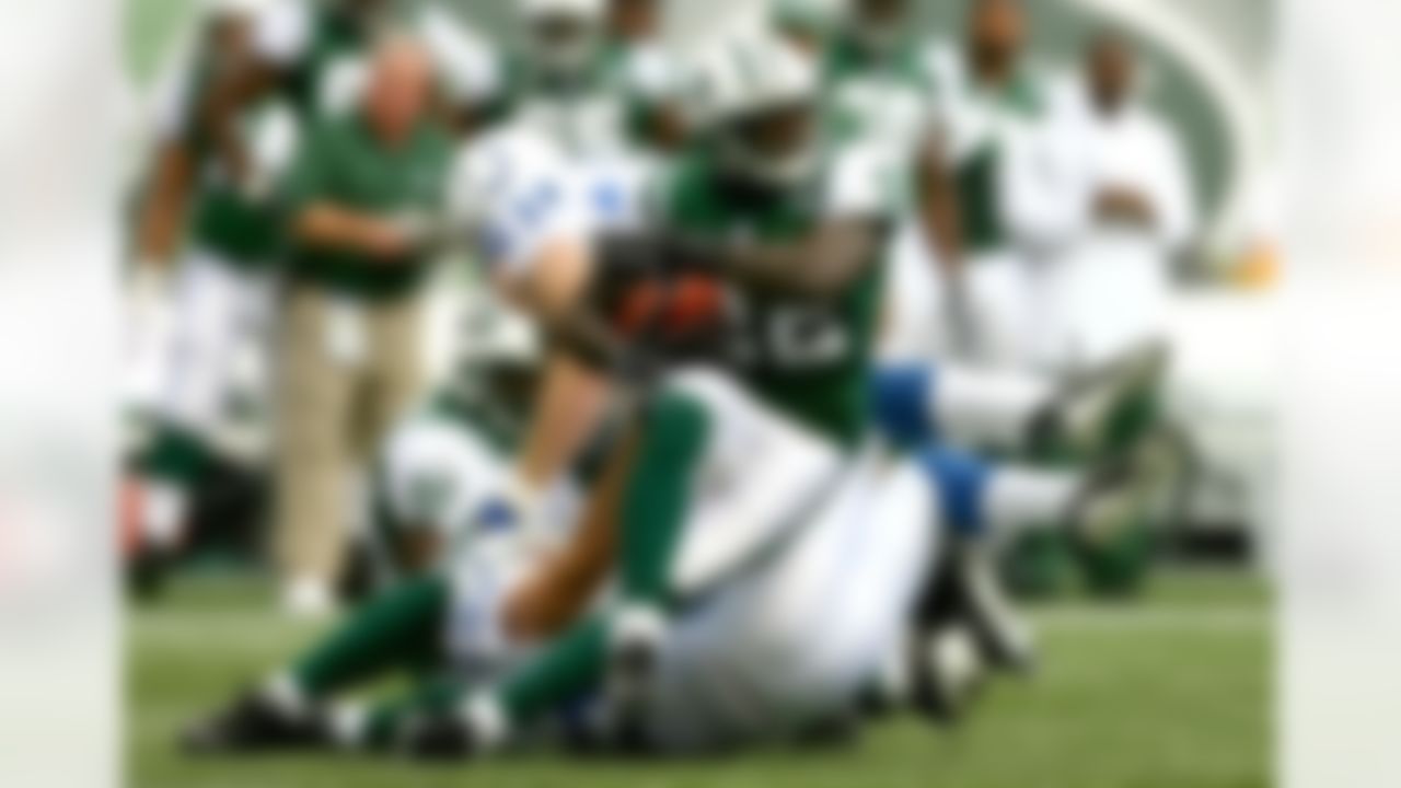 EAST RUTHERFORD, NJ - OCTOBER 01: Justin Miller #22 of the New York Jets tries to stay on his feet during the first quarter of the game against the Indianapolis Colts on October 1, 2006 at Giants Stadium in East Rutherford, New Jersey. Photo by Al Bello/Getty Images.