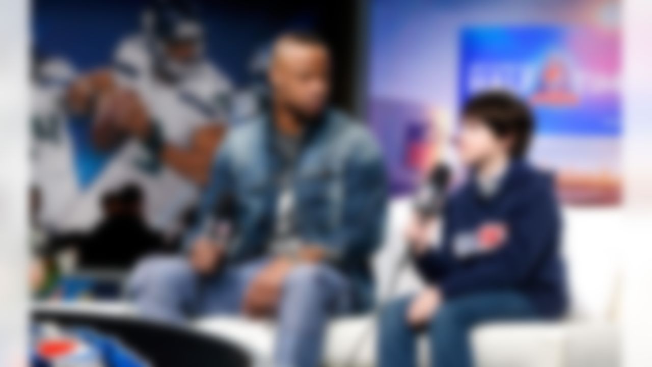 Pittsburgh Steelers cornerback Ike Taylor speaks with Steelers fan Thomas Brown on the NFL Network set on Radio Row at the Super Bowl XLVIII media center in the Sheraton Hotel on Thursday, January 30, 2014 in New York, NY. (Perry Knotts/NFL)
