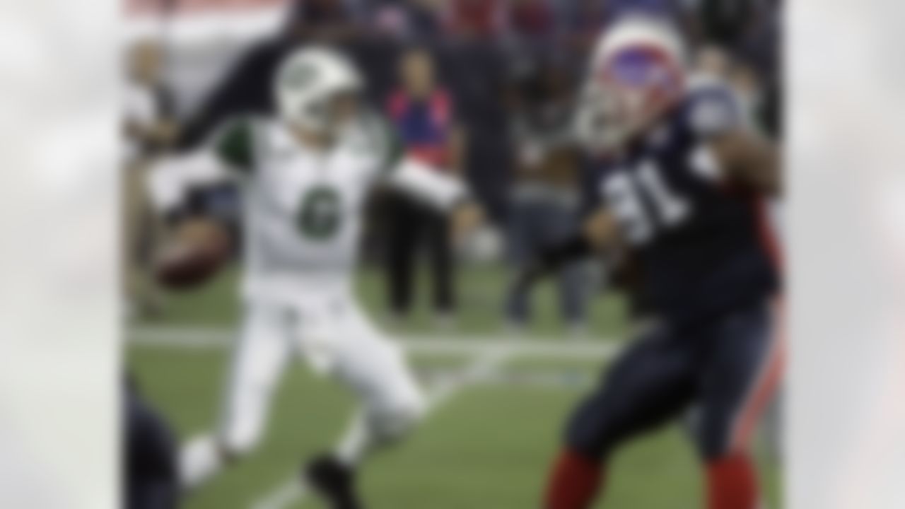New York Jets quarterback Mark Sanchez (6) passes against the Buffalo Bills in the first half of an NFL football game in Toronto, on Thursday, Dec. 3, 2009. (AP Photo/Todd Parmington)