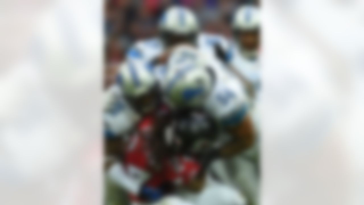 Atlanta Falcons running back Devonta Freeman (24), bottom centre, is challenged by Detroit Lions outside linebacker DeAndre Levy (54) during the NFL football game at Wembley Stadium, London, Sunday, Oct. 26, 2014. (AP Photo/Tim Ireland)
