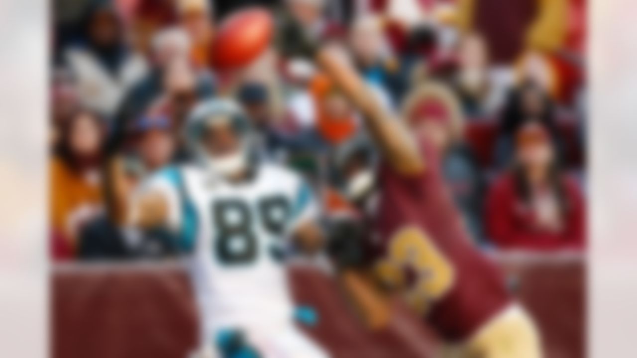 Washington Redskins cornerback DeAngelo Hall (23) deflects the ball away from Carolina Panthers wide receiver Steve Smith (89) during an NFL football game at FedEx Field on Sunday November 4, 2012 in Landover, Maryland.
