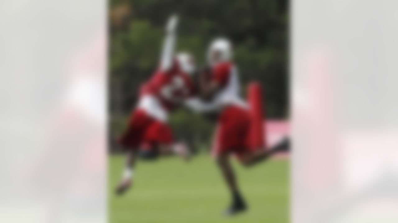 Arizona Cardinals' Stephen Williams, right, makes a catch in front of Michael Adams during NFL football training camp at Northern Arizona University, Thursday, July 26, 2012, in Flagstaff, Ariz. (AP Photo/Ross D. Franklin)