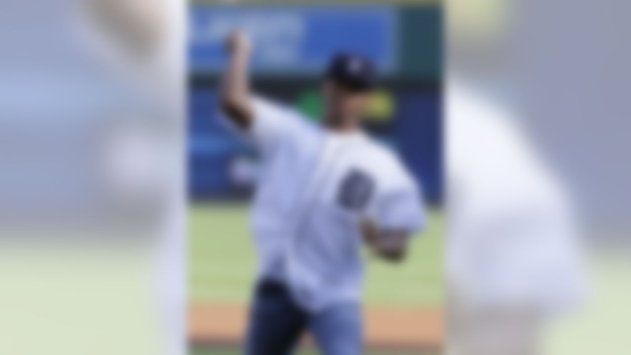 Detroit Lions wide receiver Marvin Jones, who signed with the Lions this off-season, tosses a ceremonial first pitch before the Detroit Tigers baseball game against the Chicago White Sox at Comerica Park Friday, June 3, 2016, in Detroit. (AP Photo/Duane Burleson)