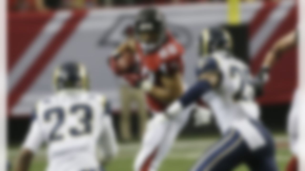 Atlanta Falcons tight end Tony Gonzalez (88) runs into the defense of St. Louis Rams free safety T.J. McDonald (25) and St. Louis Rams safety Rodney McLeod (23) during the second half of an NFL football game, Sunday, Sept. 15, 2013, in Atlanta. (AP Photo/John Bazemore)