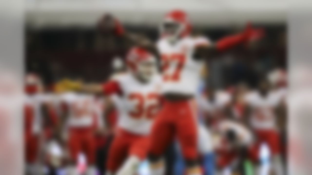 Kansas City Chiefs defensive back Rashad Fenton (27) and Tyrann Mathieu celebrate  after an interception during an NFL football game against the Los Angeles Chargers, Monday, Nov. 18, 2019 in Mexico City.