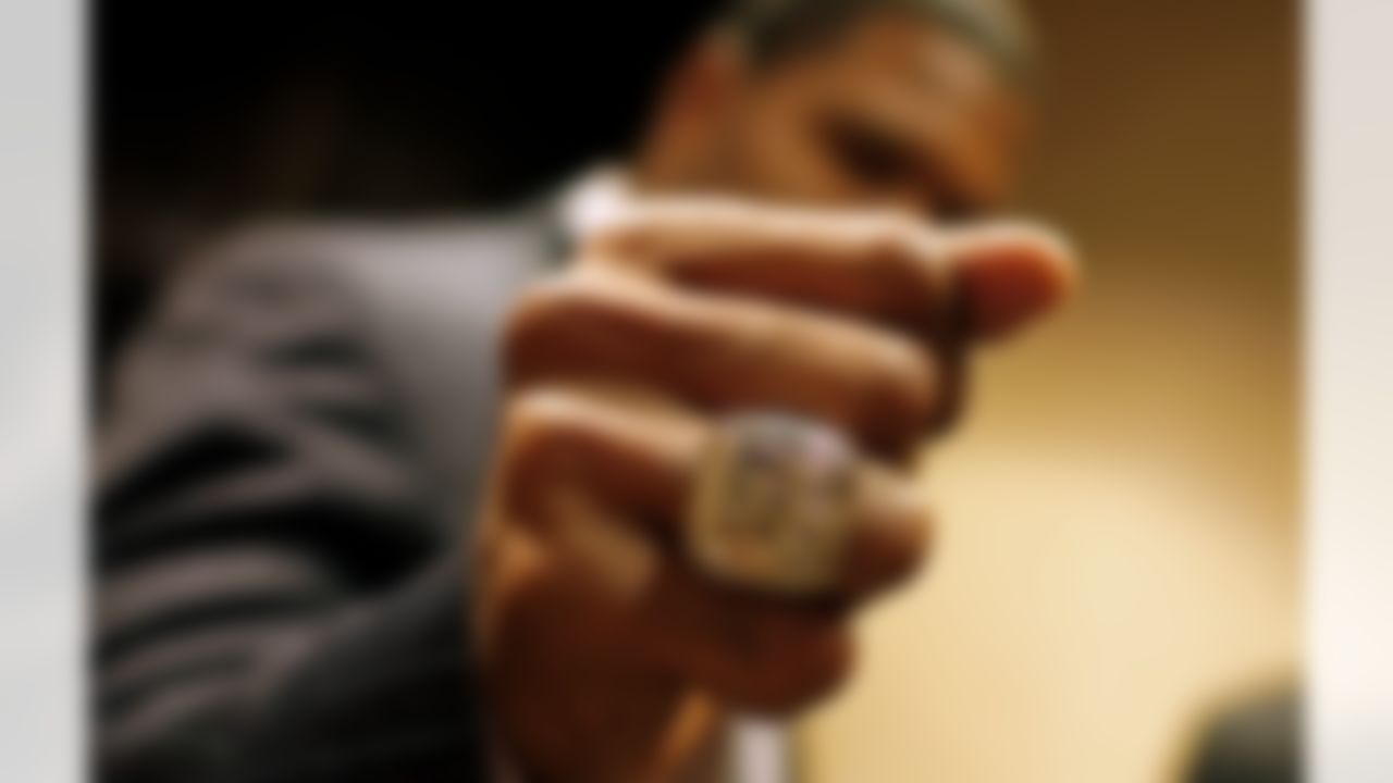 New York Giants defensive end Michael Strahan shows off his new Super Bowl ring after receiving it during a ceremony at Tiffany's Thursday, May 29, 2008 in New York. (AP Photo/Jason DeCrow)