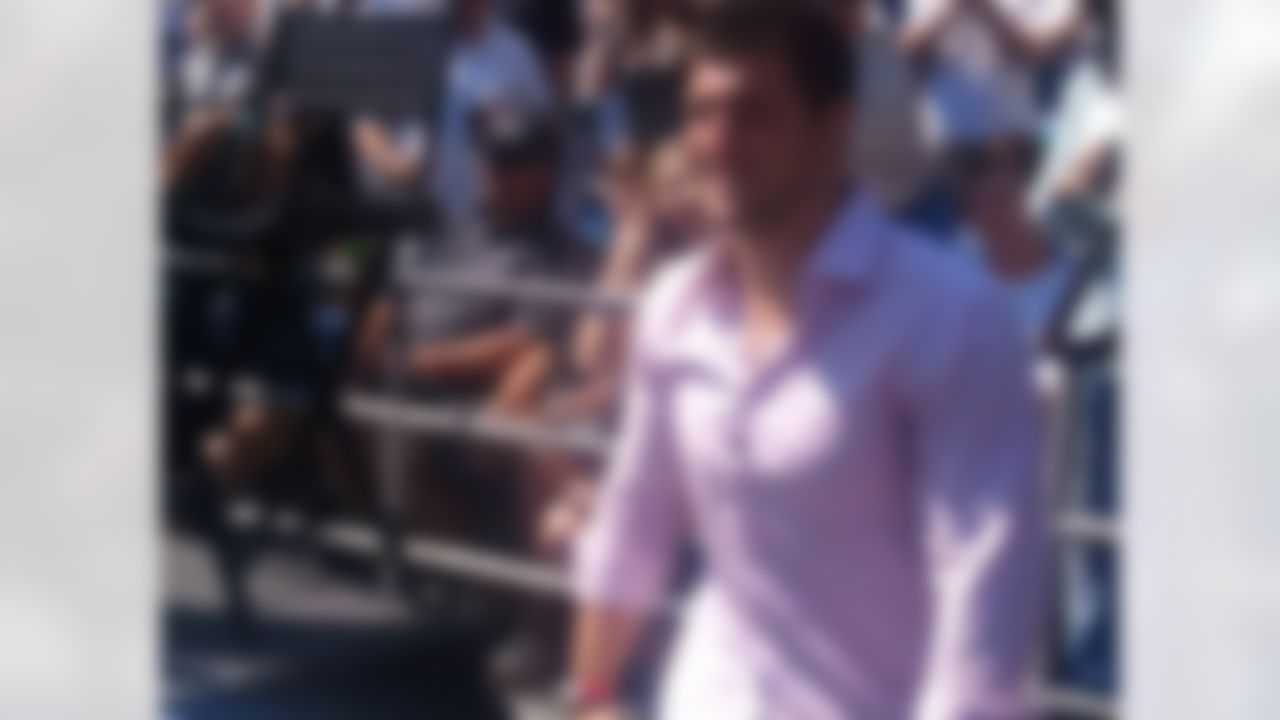 New York Jets quarterback Tim Tebow greets fans as he makes his way to the stage before delivering a sermon at Qualcomm Stadium in San Diego, California on June 17, 2012. (Kenny Legan/NFL)