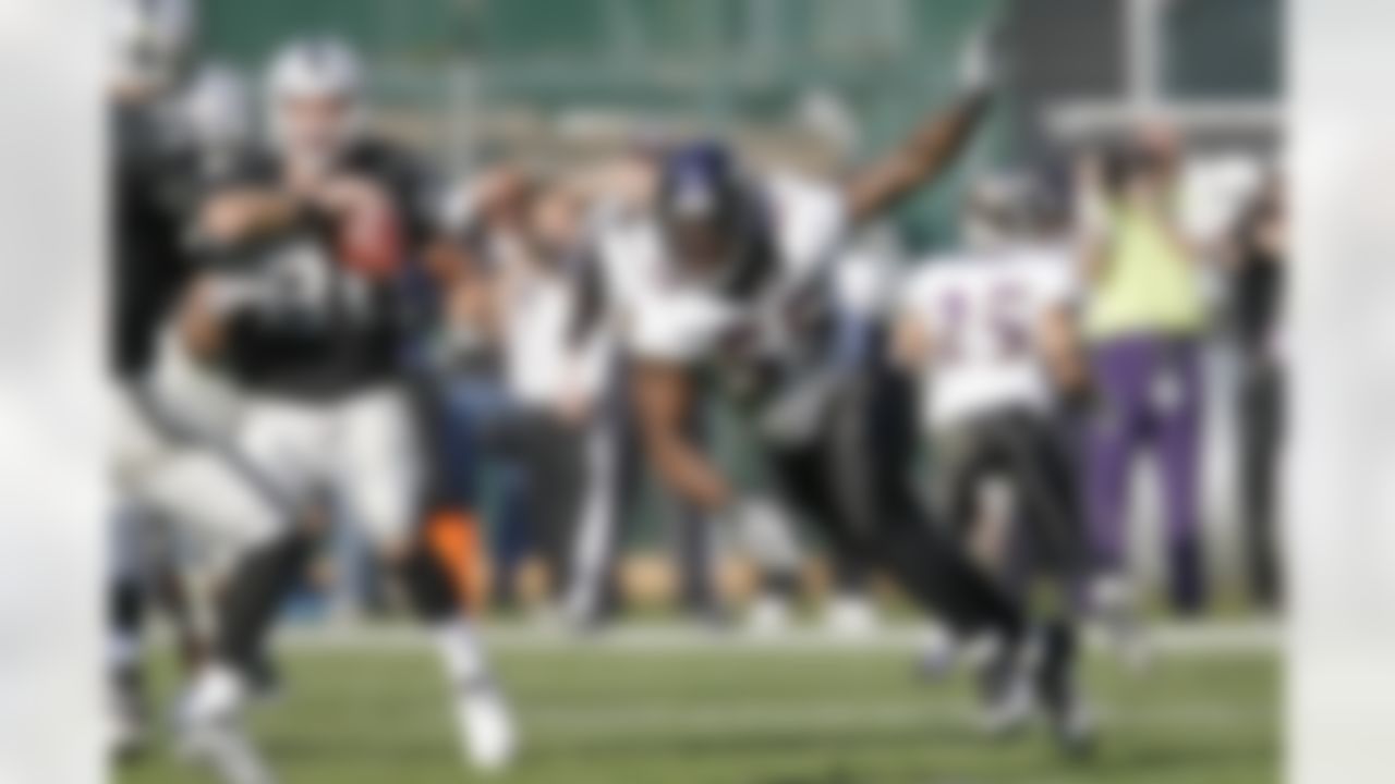 Baltimore Ravens linebacker Terrell Suggs (55) rushes the passer during an NFL game against the Oakland Raiders, Sunday, Jan. 3, 2010 in Oakland. The Ravens won the game, 21-13. (AP Photo/Greg Trott)