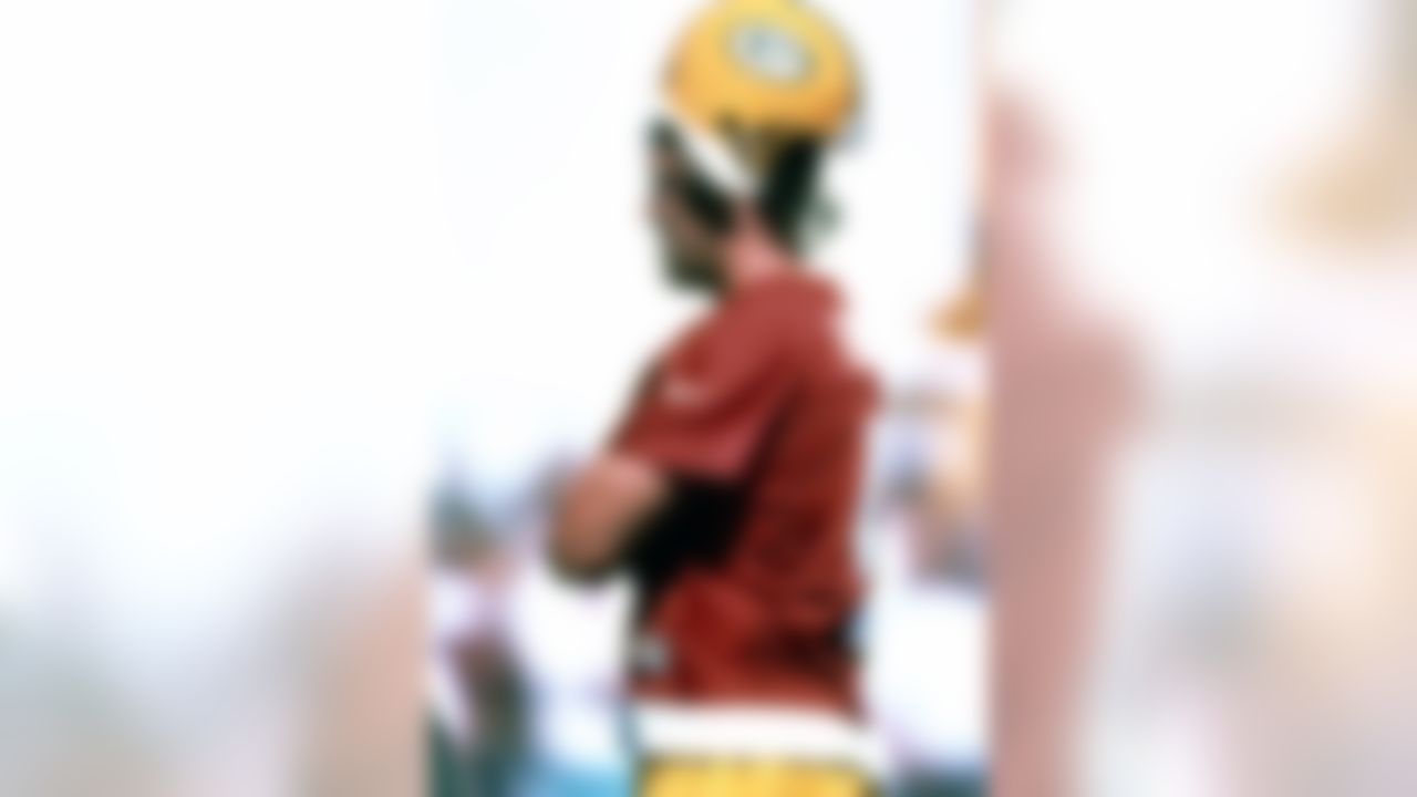 Green Bay Packers quarterback Brett Favre watches play during training camp in 1998. (Al Messerschmidt via AP)