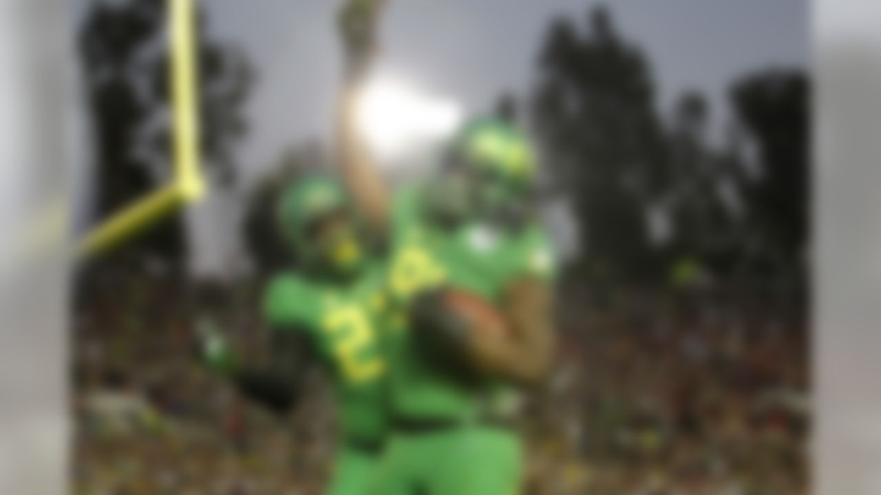 Oregon Ducks linebacker Tony Washington (91) celebrates after scoring a touchdown against the Florida State Seminoles on Thursday January 1, 2015 at the College Football Playoff Semifnal at the 101st Rose Bowl in Pasadena, Calif. (Michael Yanow/NFL)