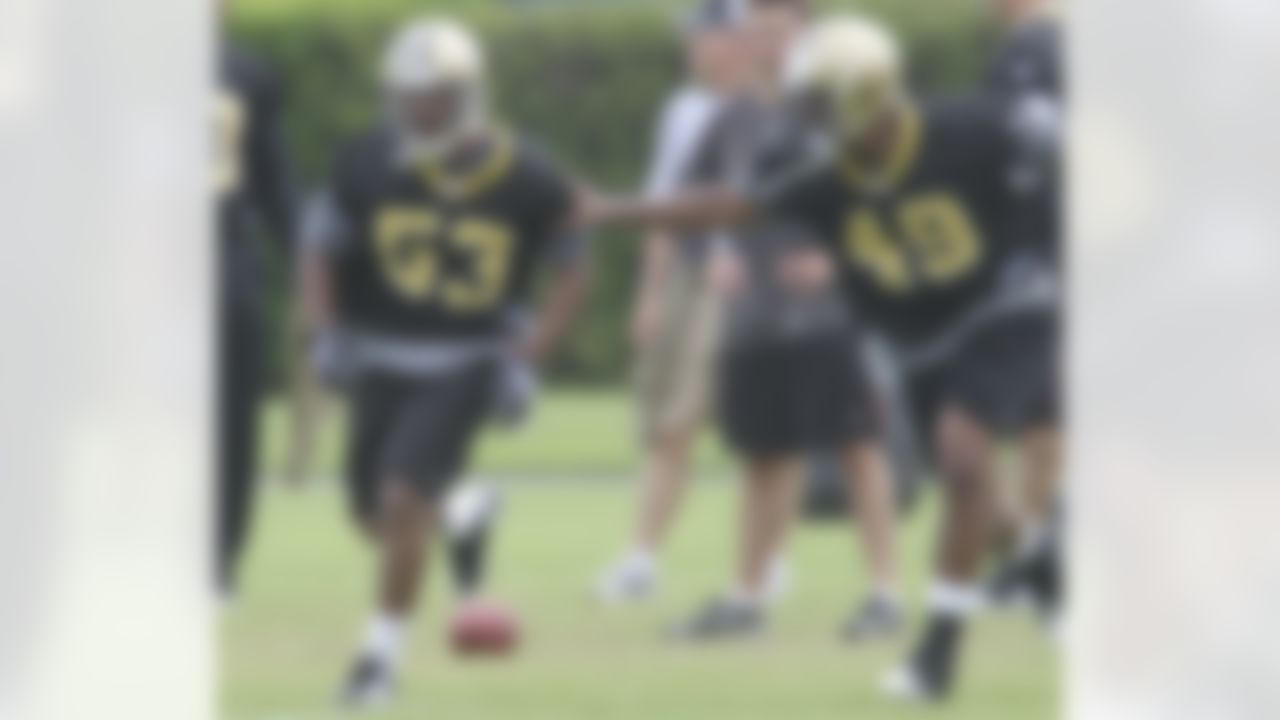 New Orleans Saints linebackers Stanley Arnoux (53) and Chris Ivory (49) participate in a drill during minicamp at the club's NFL football training facility in Metairie, Sunday, June 6, 2010. (AP Photo/Bill Haber)