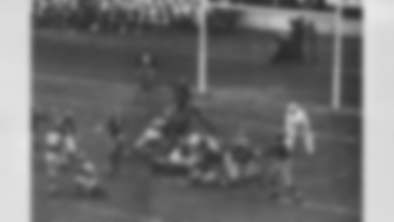 Ken Strong (30), left, kicking the 2nd of the 3 field goals which scored by the New York Giants in their game against the Washington Redskins on Dec. 3, 1939 at the Polo Grounds which the Giants Won 9-7. The ball is in the air just above Frank Filchock (30) of Redskins. The victory gave the Giants the Eastern Division Championship of the National Football League for the 2nd consecutive year. Redskins shown are Jim Barber (15) and Steve Slivinski (16). Giants are Tuffy Leemans (4), John "Bull" Karcis (11); Ed Widseth (50) and Nello "Flash" Falaschi (28). (Associated Press)