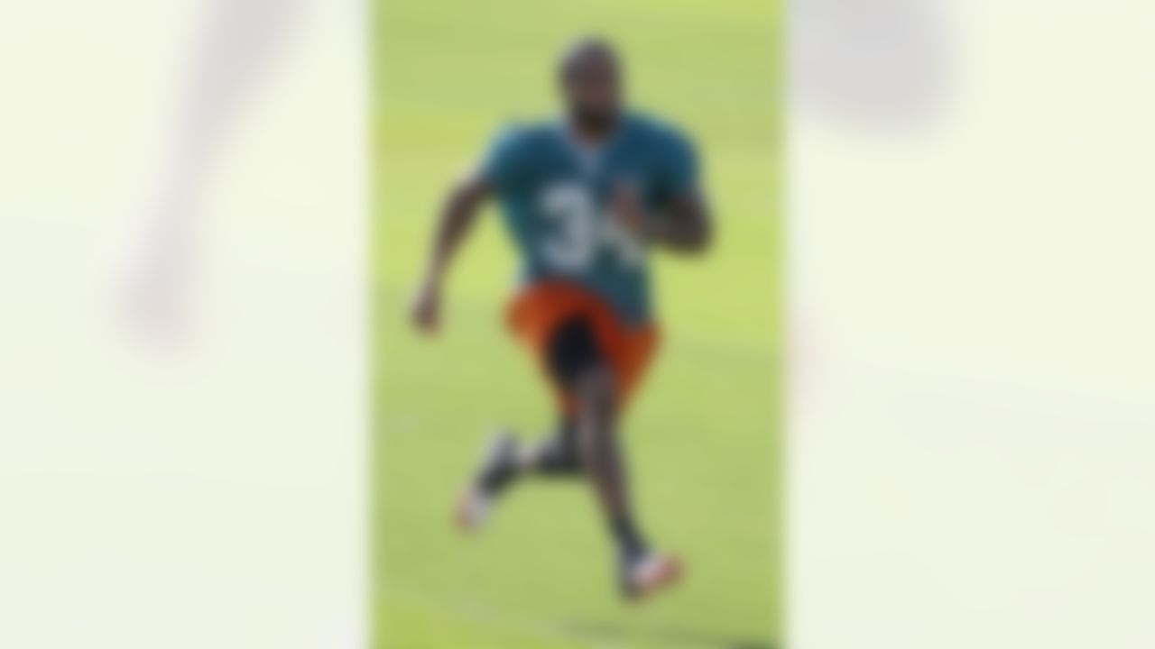 Miami Dolphins' running back Marcus Thigpen practices during NFL football training camp in Davie, Fla., Monday, Aug. 13, 2012. (AP Photo/Alan Diaz)