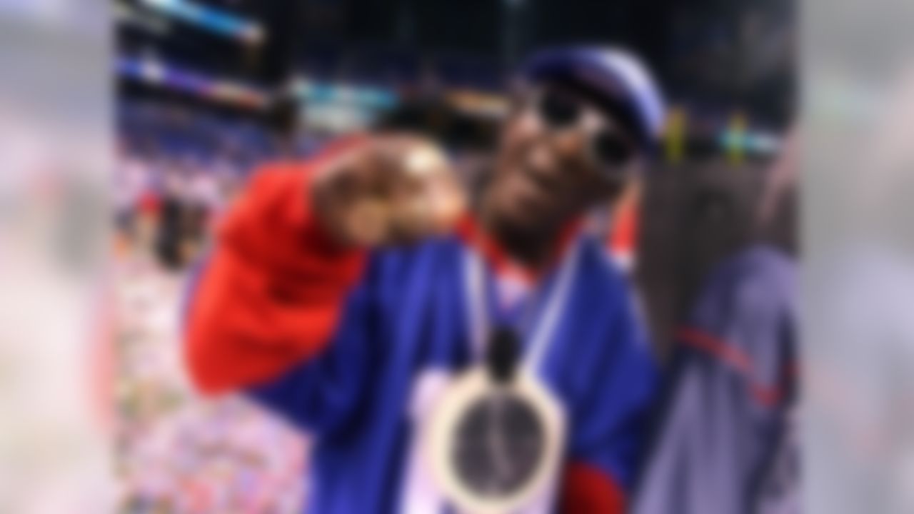 Recording artist Flavor Flav celebrates the New York Giants 21-17 victory against the New England Patriots during the NFL Super Bowl XLVI at Lucas Oil Stadium in Indianapolis, Indiana on Feb 5, 2012. (Ben Liebenberg/NFL)