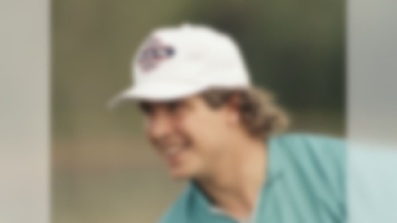 Dan Marino, Miami Dolphins quarterback. smiles as he sports a Super Bowl XIX hat during practice at the team?s Miami training camp, Jan. 8, 1985. (AP Photo/Kathy Willens)