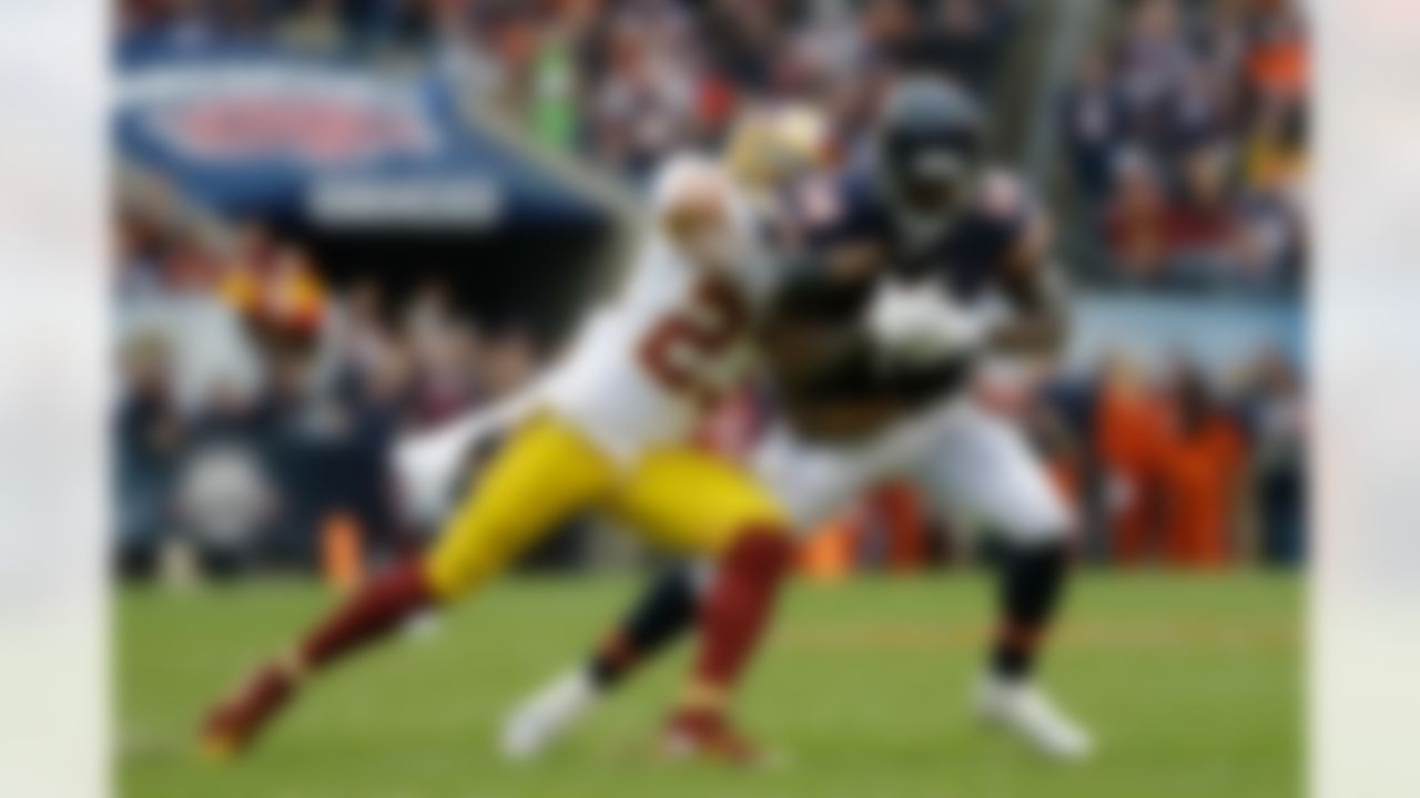 Washington Redskins cornerback DeAngelo Hall (23) tackles Chicago Bears receiver Deonte Thompson (14) during the first half of an NFL football game, Sunday, Dec. 13, 2015, in Chicago.