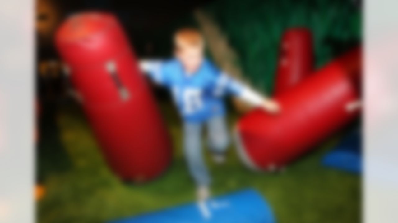 Jan 30, 2012; Indianapolis, IN, USA; Branden Beasley , age 7, runs through an excercise at the NFL rush zone in the NFL Experience during Super Bowl week at the Indiana Convention Center. The New York Giants will play the New England Patriots in Super Bowl XLVI . Mandatory Credit: Matthew Emmons-US PRESSWIRE