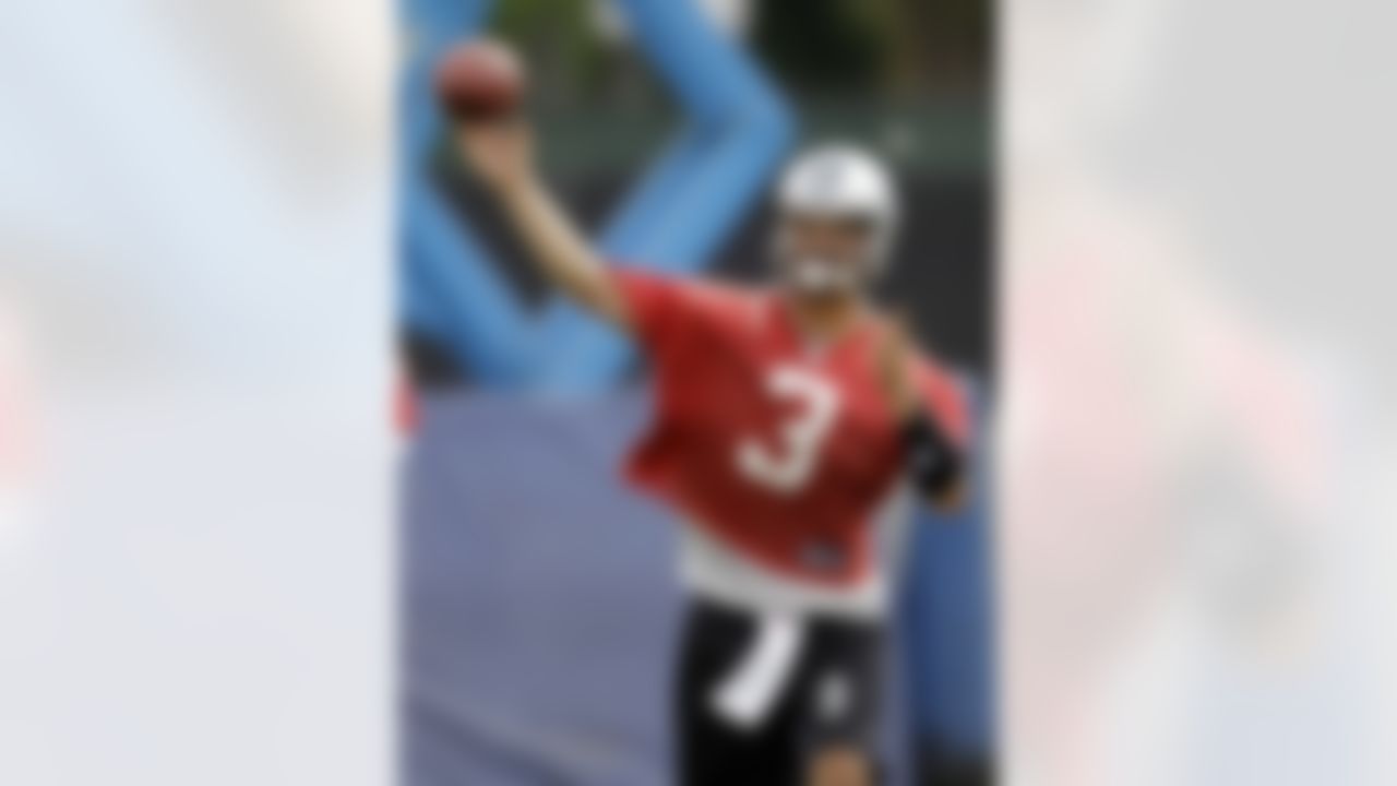 Carolina Panthers quarterback Matt Moore (3) throws a pass during a summer training practice session for the NFL football team in Charlotte, N.C., Wednesday, June 16, 2010. (AP Photo/Chuck Burton)