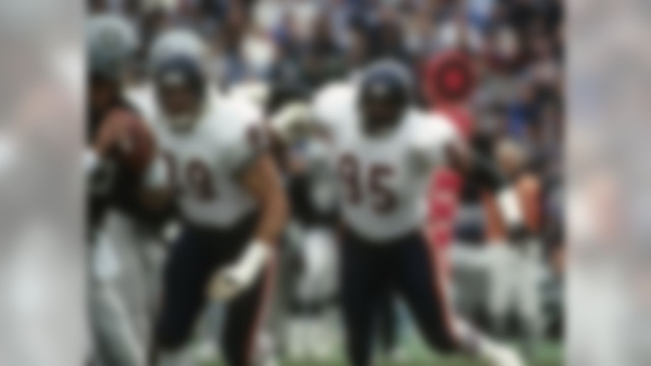 Chicago Bears defensive end Richard Dent (95) and Hall of Fame defensive tackle Dan Hampton (99) pressure the quarterback during a 6-3 Bears victory on December 27, 1987, at the Los Angeles Memorial Coliseum in Los Angeles, California. (National Football League)