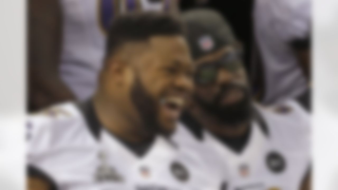 Baltimore Ravens defensive tackle Bryan Hall and safety Ed Reed, right, pose for a team photo during media day for the NFL Super Bowl XLVII football game Tuesday, Jan. 29, 2013, in New Orleans. (AP Photo/Pat Semansky)