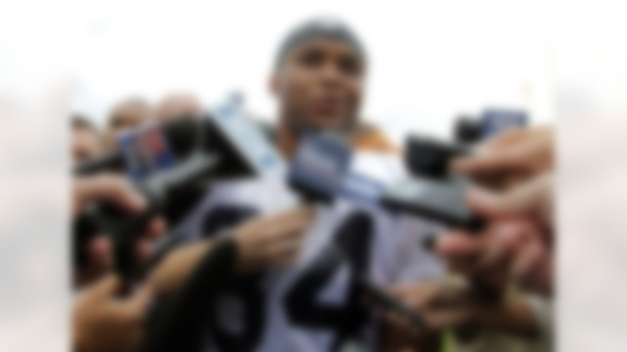 New England Patriots running back Shane Vereen is surrounded by microphones while taking questions from reporters at the conclusion of an NFL football training camp in Foxborough, Mass., Sunday, July 29, 2012. (AP Photo/Steven Senne)
