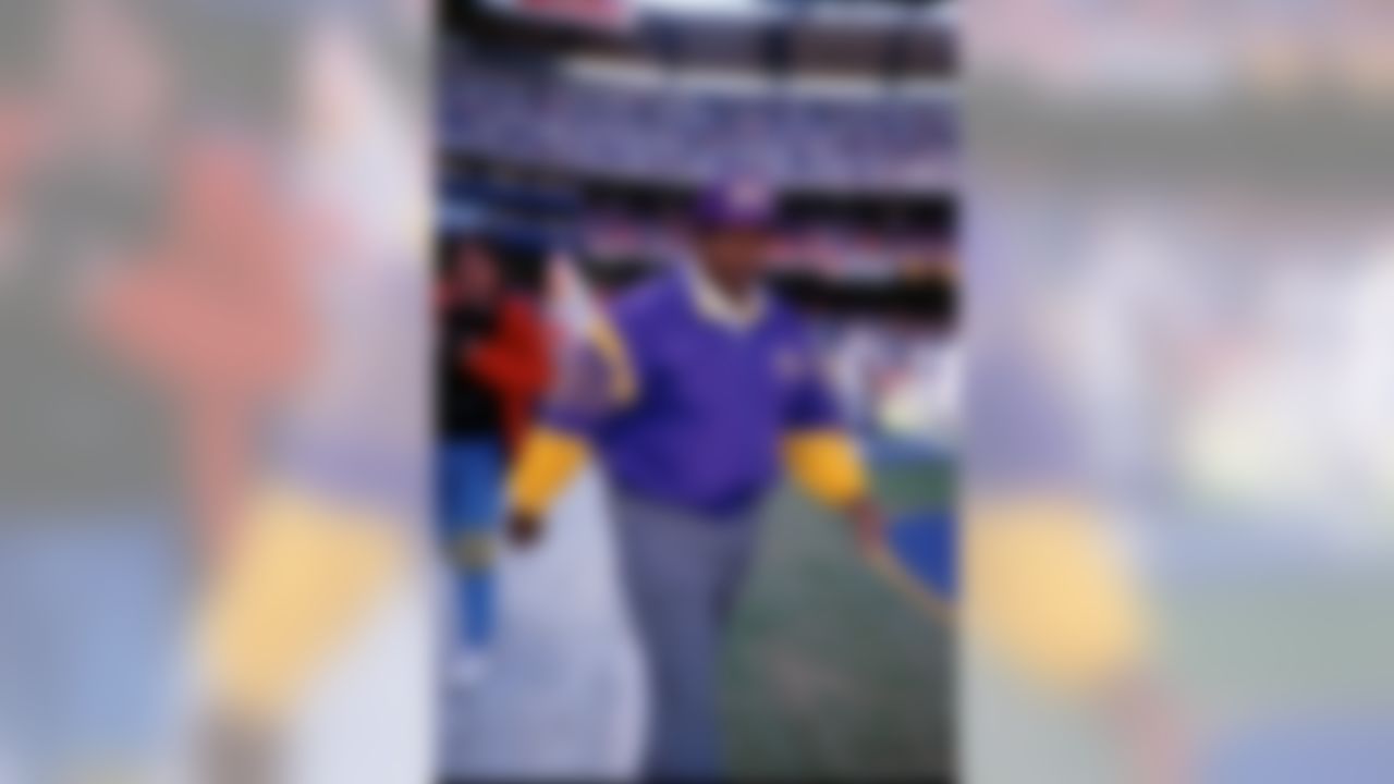 Minnesota Vikings head coach Dennis Green walks onto the field prior to a game.
Circa the 1990's. (Icon Sportswire via AP Images)