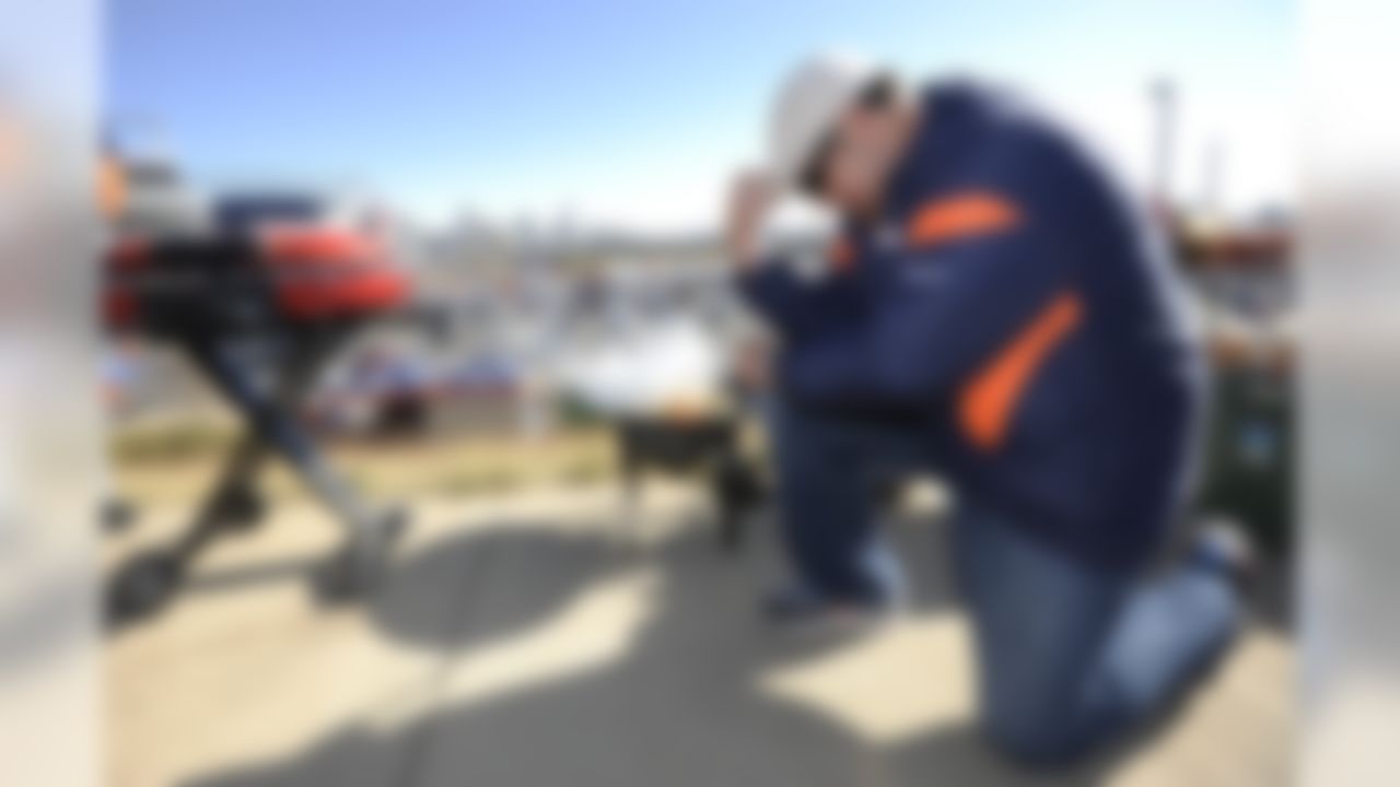 John Vialpando, of Denver, is seen Tebowing while tailgating before an NFL football game between the Denver Broncos and Detroit Lions, Sunday, Oct. 30, 2011, in Denver. (AP Photo/Jack Dempsey)