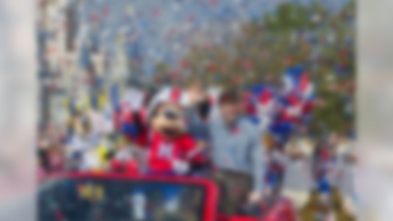 Super Bowl XLVI MVP and New York Giants quarterback Eli Manning takes a celebratory ride with Mickey Mouse Monday Feb. 6, 2012 at the Magic Kingdom at Walt Disney World Resort in Lake Buena Vista, Fla. The celebration at the theme park took place only one day after Manning led his team to a 21-17 victory over the New England Patriots in Super Bowl XLVI in Indianapolis. Immediately following the game, Manning looked into TV cameras and shouted "I'm Going to Disney World!" He is the latest star in the famous Disney commercial series. (AP Photo/Disney, Gene Duncan)