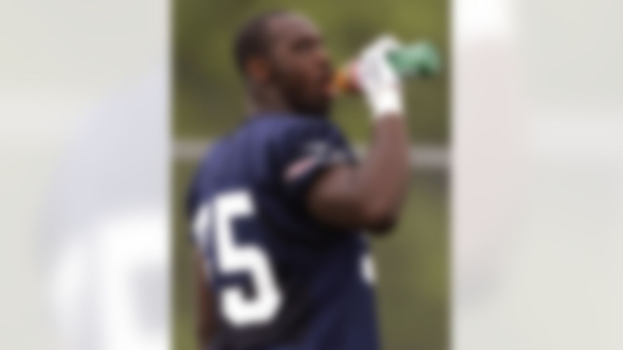 New England Patriots rookie defensive end Chandler Jones takes a drink during practice on the second day of NFL football training camp in Foxborough, Mass., Friday, July 27, 2012. (AP Photo/Stephan Savoia)
