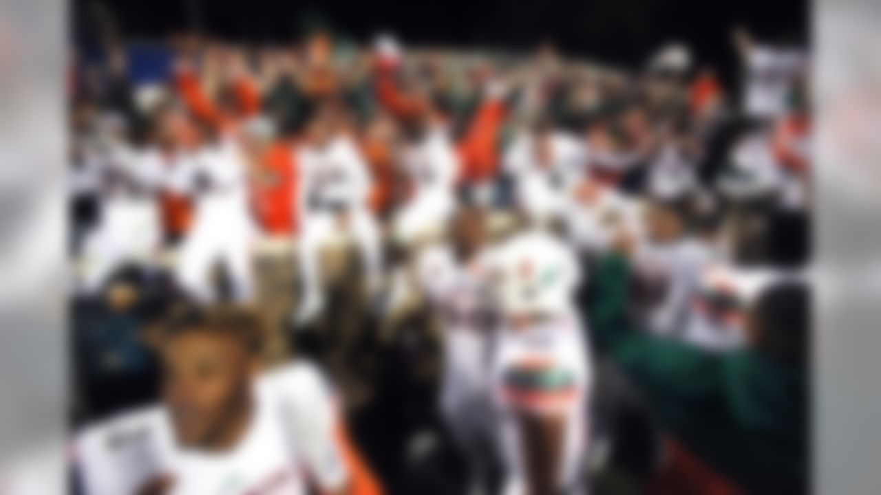 Oct 31, 2015; Durham, NC, USA; The Miami Hurricanes celebrate with their fans after beating the Duke Blue Devils 30-27 at Wallace Wade Stadium. (Mark Dolejs-USA TODAY Sports)