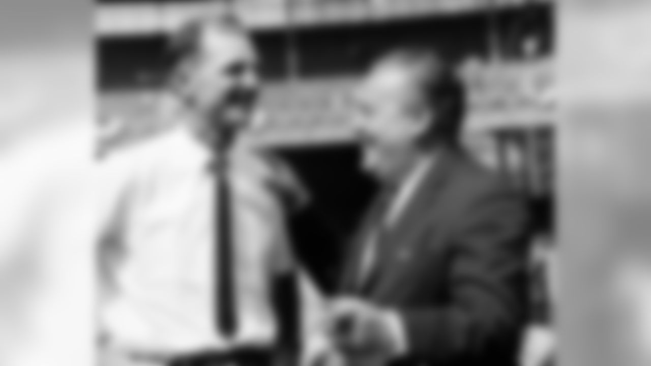Coach Sammy Baugh, left, of the New York Titans, and Titans owner Harry Wismer exchange a laugh before the New York-Denver game at the Polo Grounds in New York, Sept. 24, 1961. New York won 35-28. (AP Photo/Harry Harris)