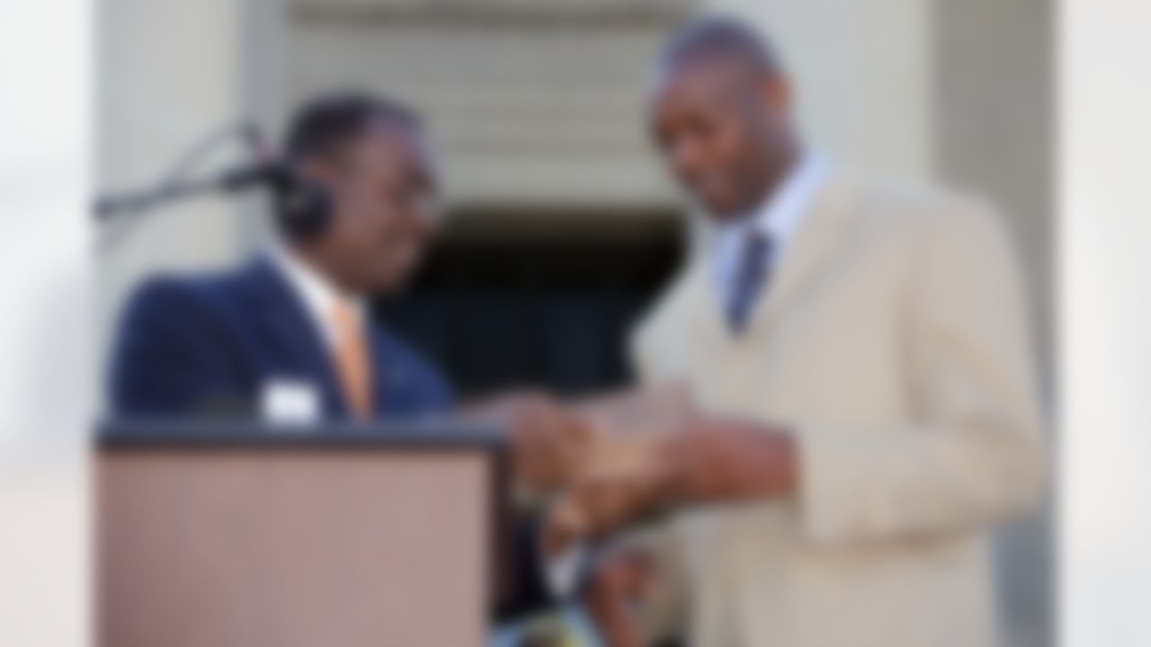 Buffalo Bills' Terrell Owens, right, accepts the key to the city from Buffalo Mayor Byron Brown, in Buffalo, N.Y., Monday, May 18, 2009. (AP Photo/David Duprey)