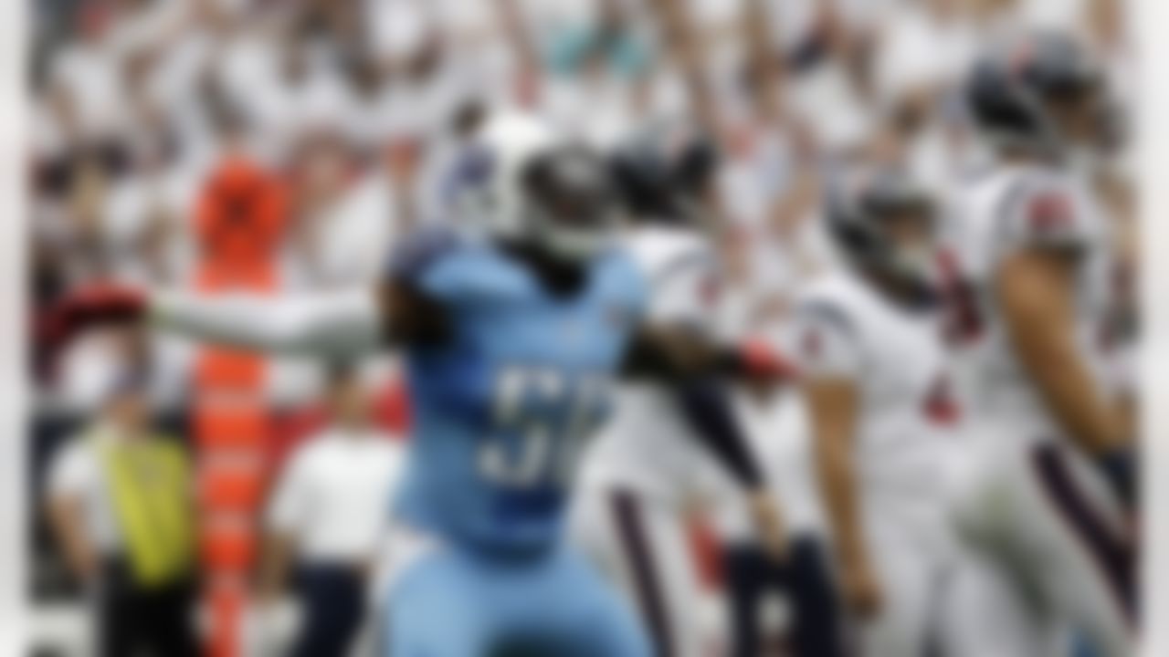 Tennessee Titans' Akeem Ayers (56) signals after Houston Texans' Randy Bullock missed a field goal-attempt during the first quarter of an NFL football game on Sunday, Sept. 15, 2013, in Houston. (AP Photo/David J. Phillip)