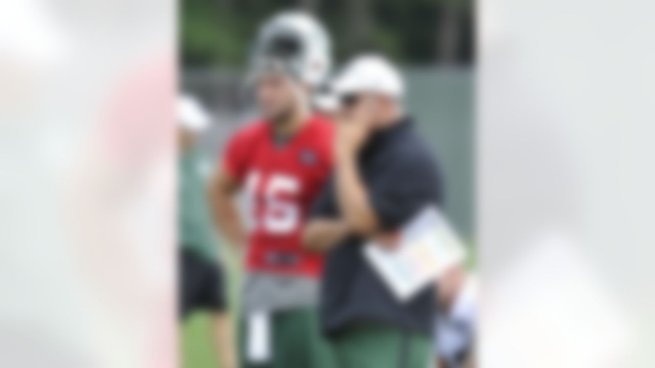 New York Jets quarterbacks coach Matt Cavanaugh, right, and quarterback Tim Tebow look on during practice on opening day of their NFL football training camp Friday, July 27, 2012, in Cortland, N.Y. (AP Photo/Bill Kostroun)