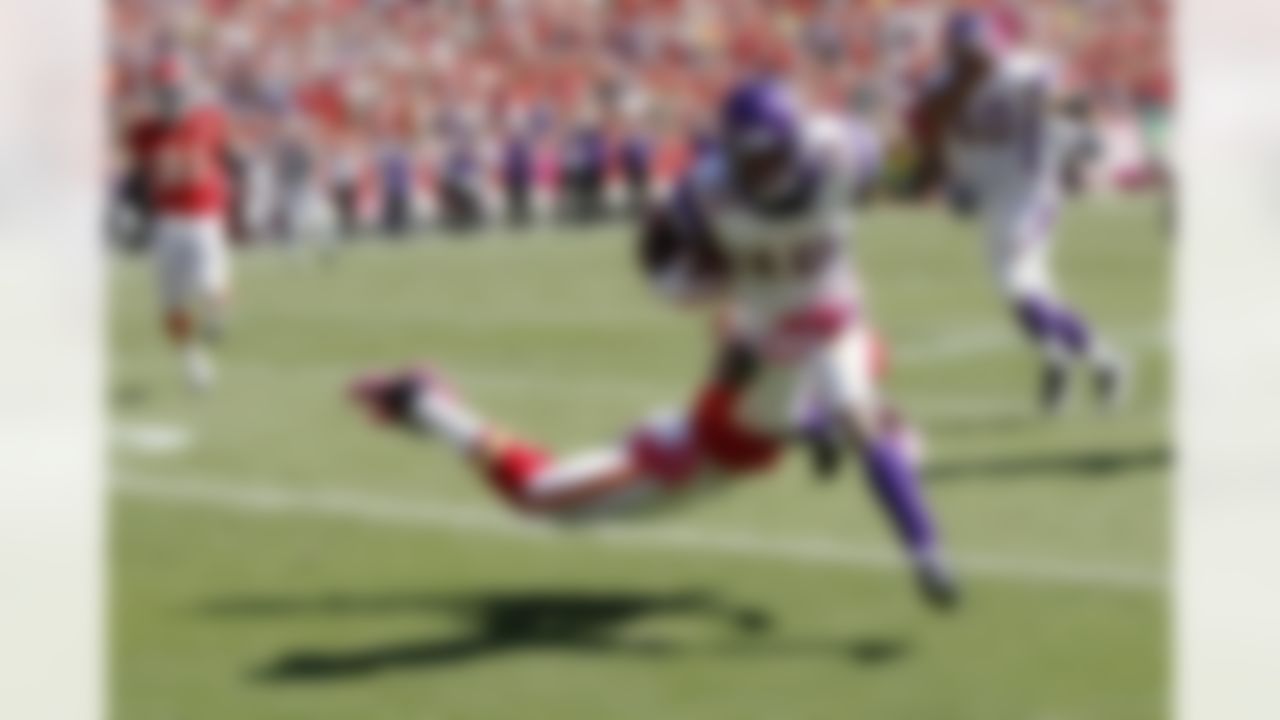 Minnesota Vikings wide receiver Percy Harvin (12) runs for a first down on a gain of 13 yards on a second quarter pass reception during the NFL week 4 football game against the Kansas City Chiefs on Sunday, October 2, 2011 in Kansas City, Missouri. The Chiefs won the game 22-17. (AP Photo/Paul Spinelli)