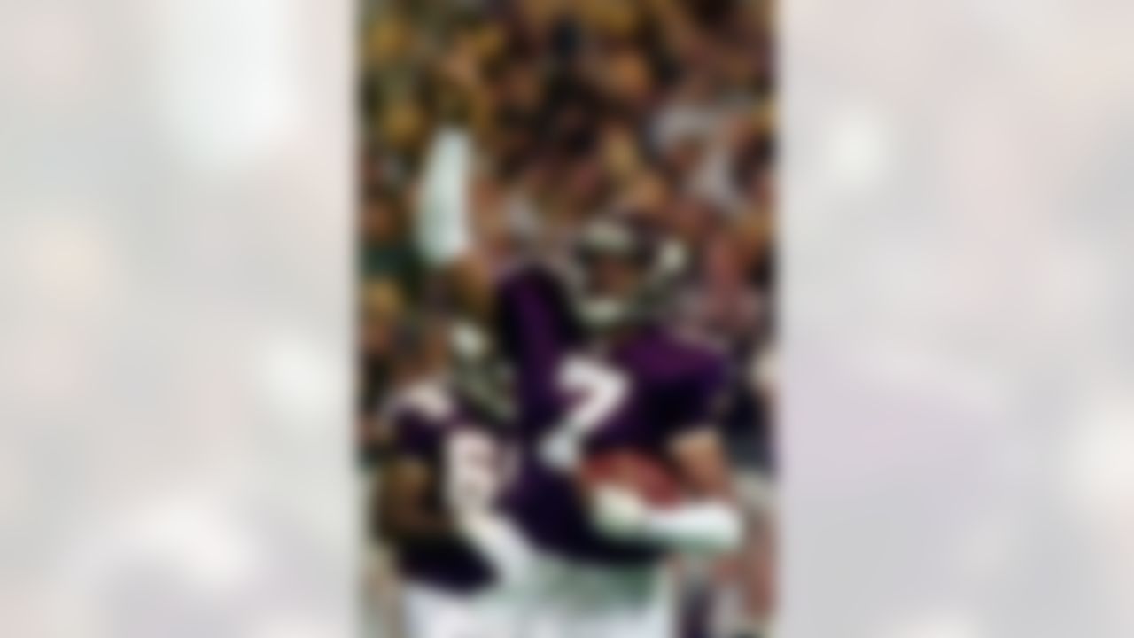 Minnesota Vikings quarterback Randall Cunningham celebrates after he dove for a 1-yard touchdown in the second quarter against the Atlanta Falcons during the NFC Championship game on this Jan. 17, 1999. (AP Photo/Morry Gash)