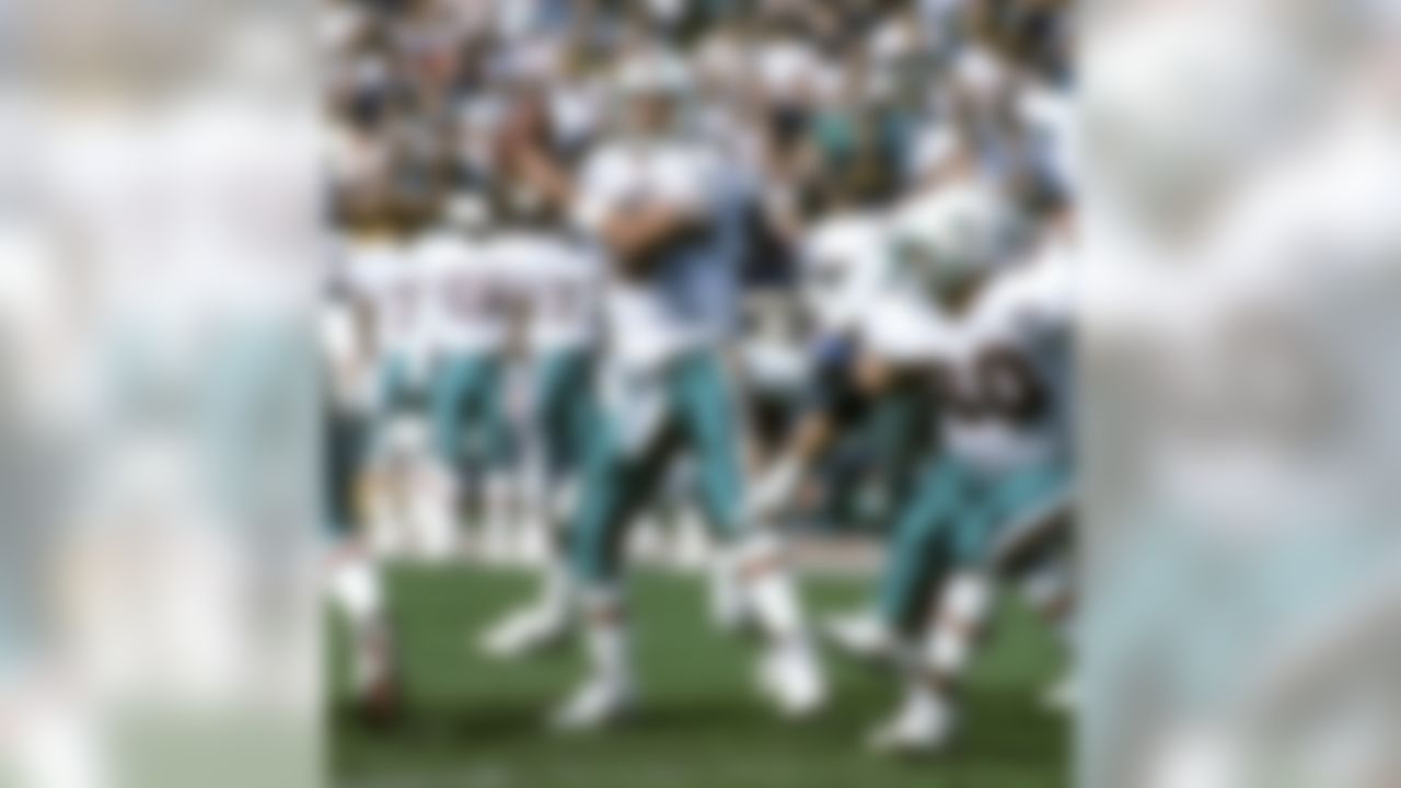 Hall of Fame quarterback Dan Marino of the Miami Dolphins sets to throw a pass during the Dolphins 22-21 loss to the San Diego Chargers in the 1994 AFC Divisional Playoff Game on January 8, 1995 at Jack Murphy Stadium in San Diego, California. 1994 AFC Divisional Playoff Game - Miami Dolphins vs San Diego Chargers - January 8, 1995 (AP Photo/NFL Photos)