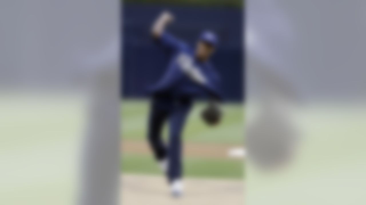 San Diego Chargers wide receiver Danario Alexander throws a ceremonial first pitch before the San Diego Padres host the St. Louis Cardinals on Wednesday, May 22, 2013. (AP Photo/Gregory Bull)