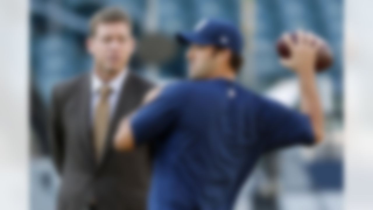 Dallas Cowboys quarterback Tony Romo, right, talks with former Cowboys' quarterback Troy Aikman during warm ups before an NFL football game against the Philadelphia Eagles, Sunday, Nov. 11, 2012, in Philadelphia. (AP Photo/Julio Cortez)