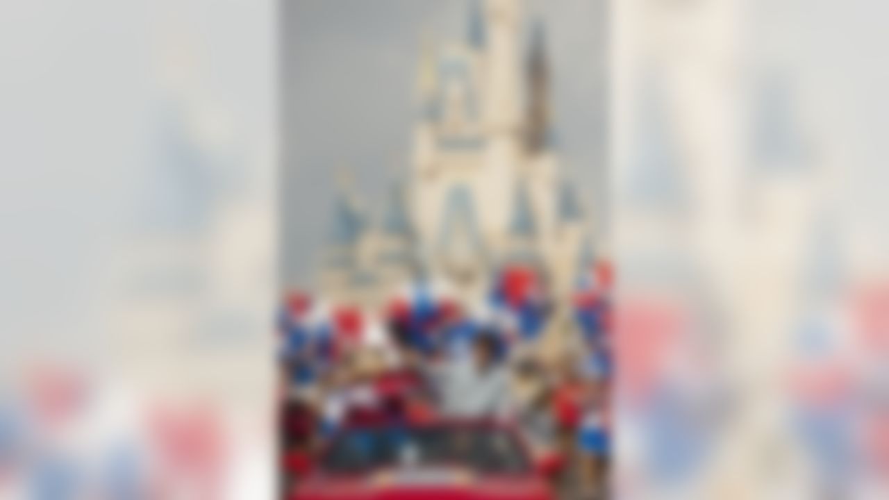 Super Bowl XLVI MVP and New York Giants quarterback Eli Manning takes a celebratory ride with Mickey Mouse Monday, Feb. 6, 2012 at the Magic Kingdom at Walt Disney World Resort in Lake Buena Vista, Fla. The celebration at the theme park took place only one day after Manning led his team to a 21-17 victory over the New England Patriots in Super Bowl XLVI in Indianapolis. Immediately following the game, Manning looked into TV cameras and shouted "I'm Going to Disney World!" He is the latest star in the famous Disney commercial series. (AP Photo/Disney, Matt Stroshane)