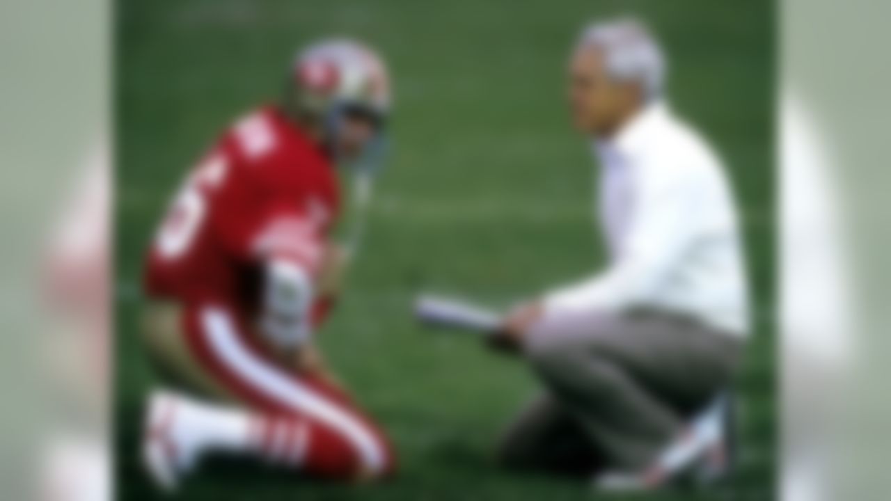 San Francisco 49ers Hall of Fame quarterback Joe Montana (16) confers with Hall of Fame head coach Bill Walsh during the 1984 NFC Championship Game, a 23-0 victory over the Chicago Bears on January 6, 1985, at Candlestick Park in San Francisco, California. (National Football League)