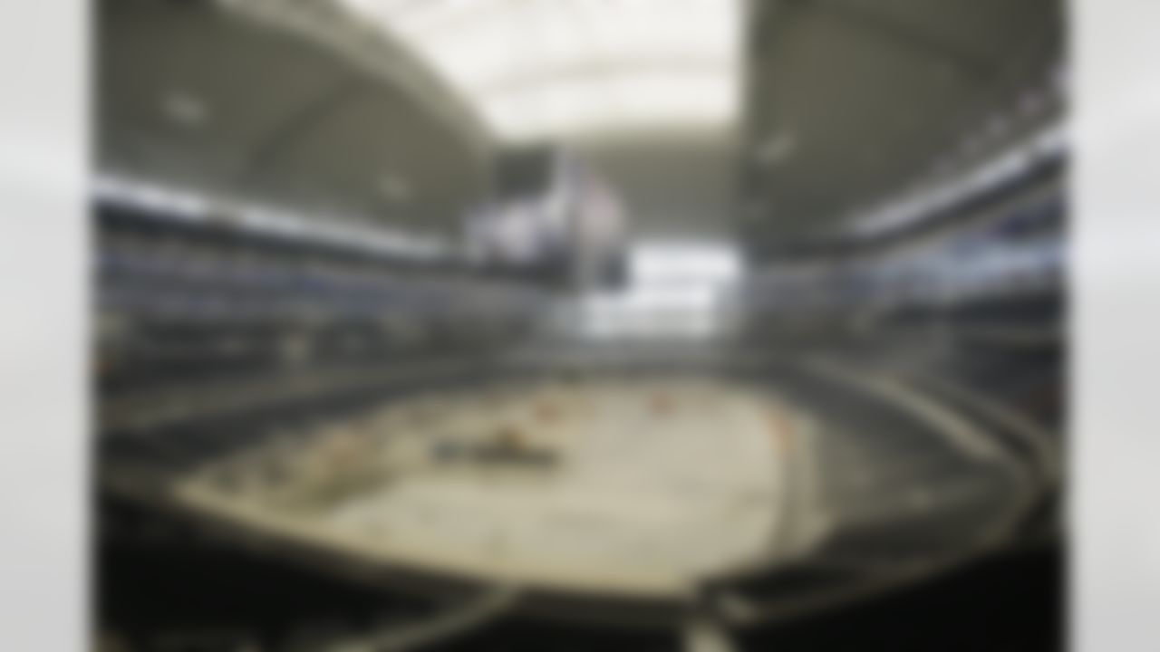 Crews continue to work on the field level of the new Cowboys Stadium after a ribbon-cutting ceremony, Wednesday, May 27, 2009, in Arlington, Texas. (AP Photo/Matt Slocum)