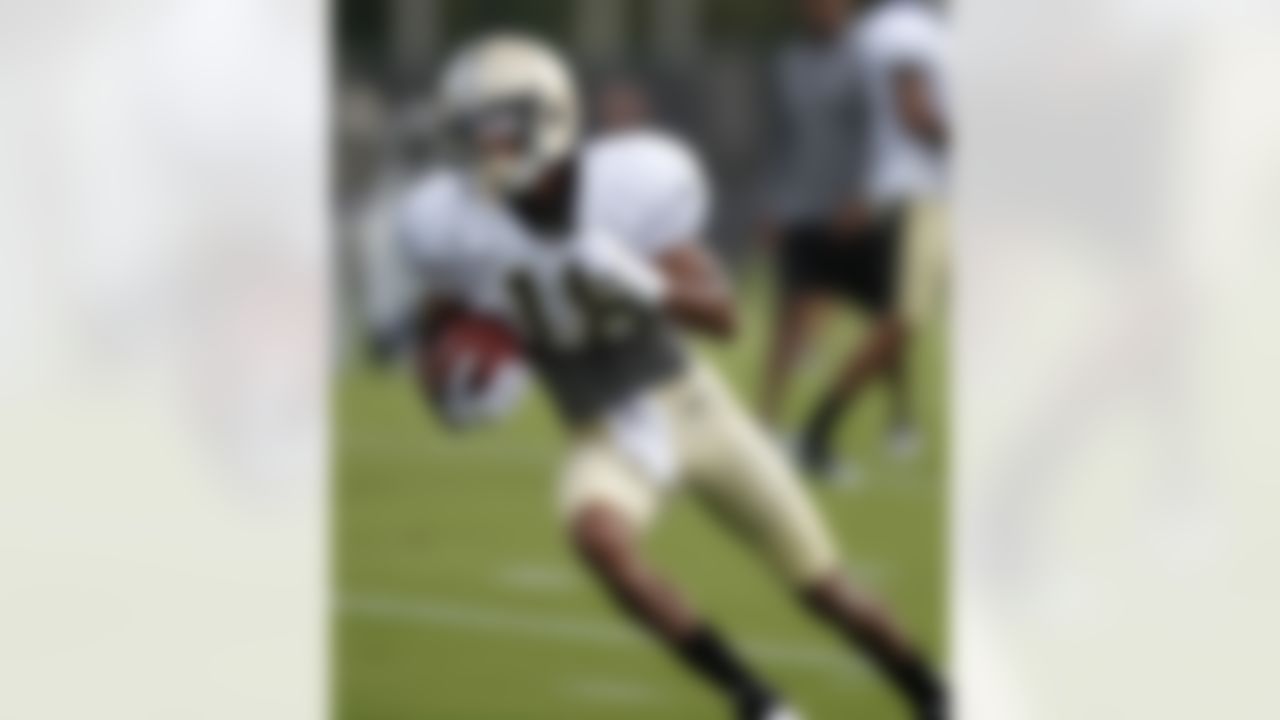 New Orleans Saints Marques Clark runs a route after catching a pass during NFL football training camp in Metairie, La., Saturday, July 28, 2012. (AP Photo/Gerald Herbert)18