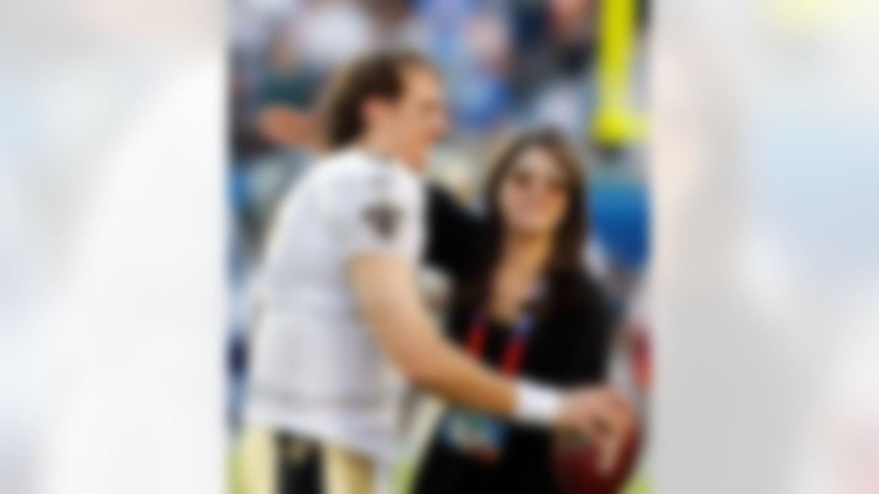 New Orleans Saints quarterback Drew Brees (9) is greeted by owner Rita Benson LeBlanc prior to Super Bowl XLIV at Sun Life Stadium in Miami Gardens, Fla. on Feb. 7, 2010. (Ben Liebenberg/NFL.com)