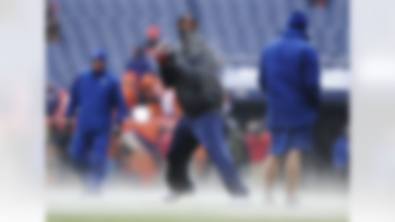 Denver Broncos quarterback Brock Osweiler warms up in seven degree Fahrenheit temperatures before playing the Baltimore Ravens in an AFC divisional playoff NFL football game, Saturday, Jan. 12, 2013, in Denver. (AP Photo/Jack Dempsey)