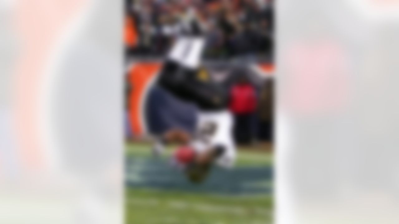 CHICAGO - JANUARY 21: Reggie Bush #25 of the New Orleans Saints flips into the endzone on an 88-yard touchdown reception in the third quarter against the Chicago Bears during the NFC Championship Game January 21, 2007 at Soldier Field in Chicago, Illinois. Photo by Getty Images.