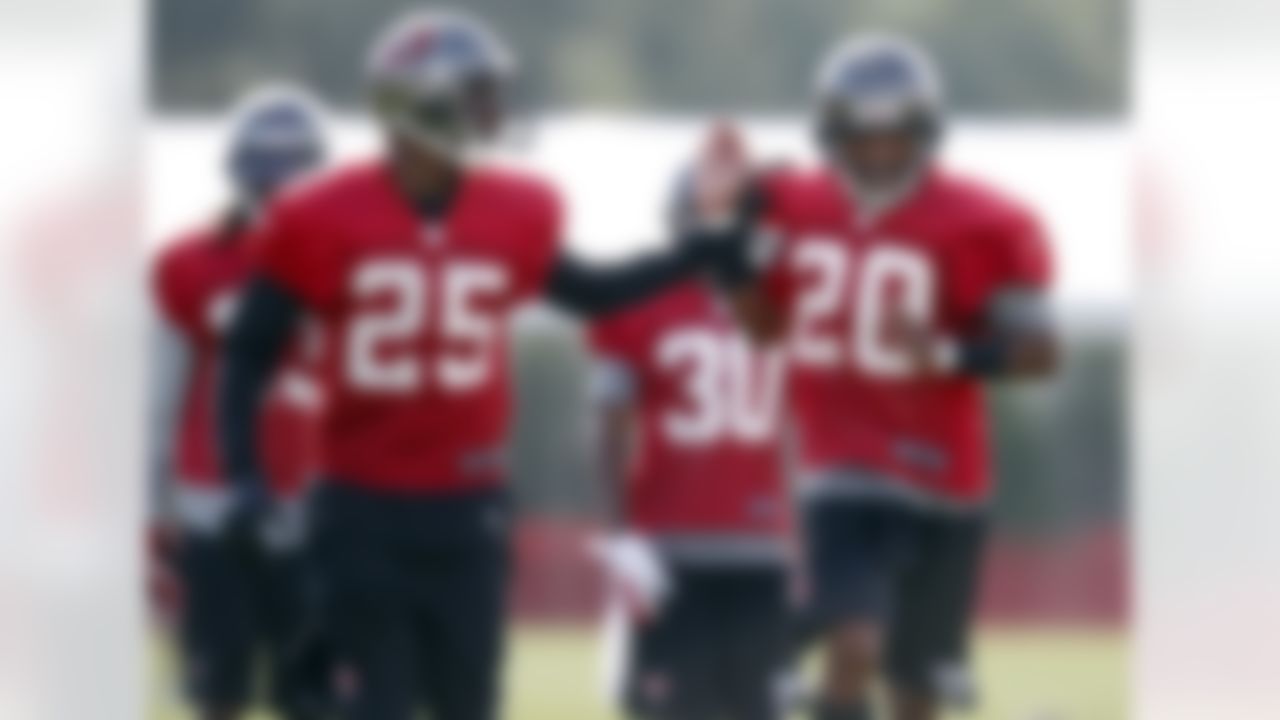Tampa Bay Buccaneers' Aqib Talib, left, and Ronde Barber participate in a drill during a workout at NFL football training camp, Saturday, July 28, 2012, in Tampa, Fla. (AP Photo/Mike Carlson)
